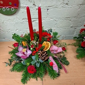 Christmas celebration candle table arrangement